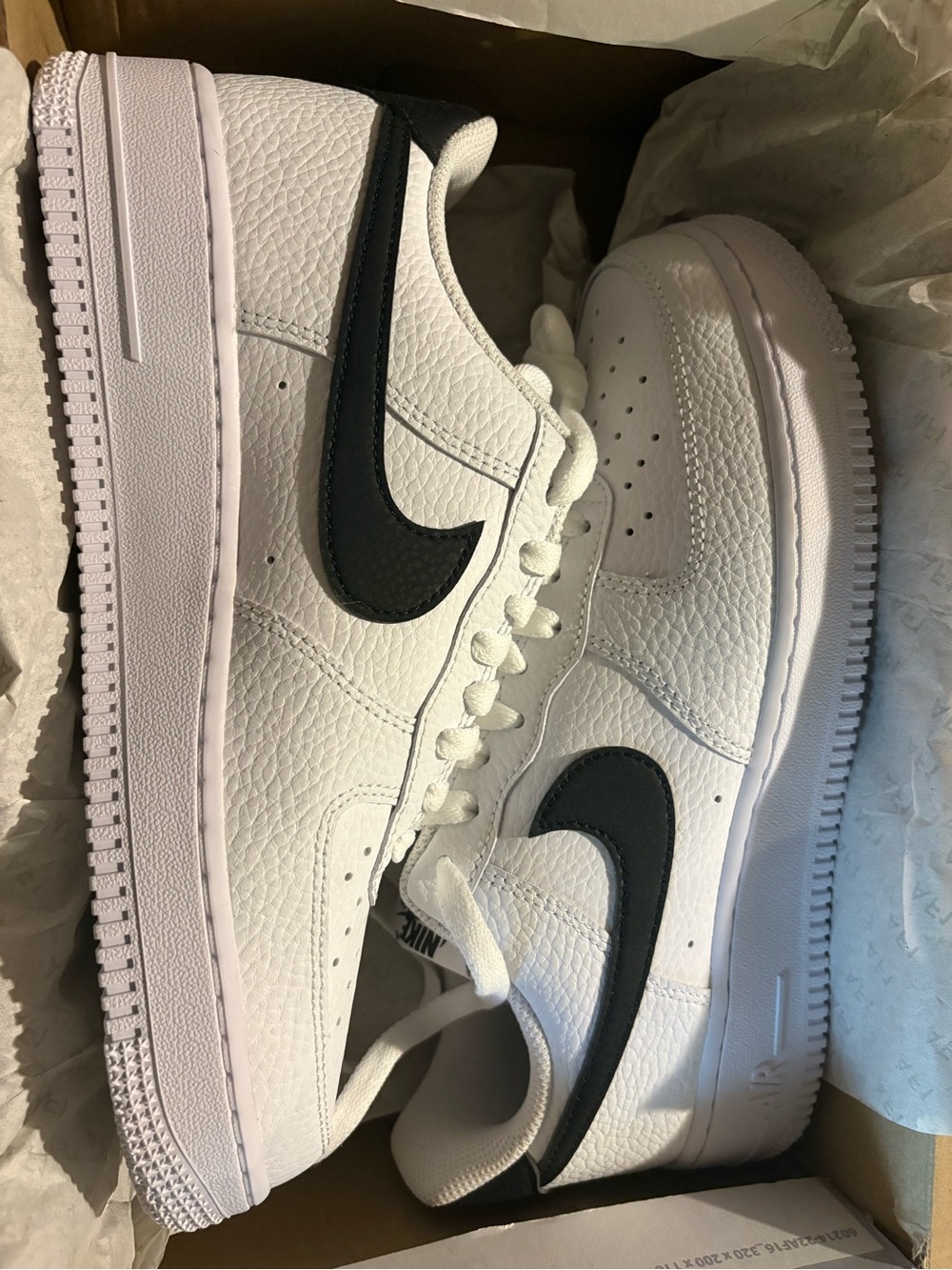 Nike Women’s Air Force 1 Leather Sneakers in White with Black Swoosh